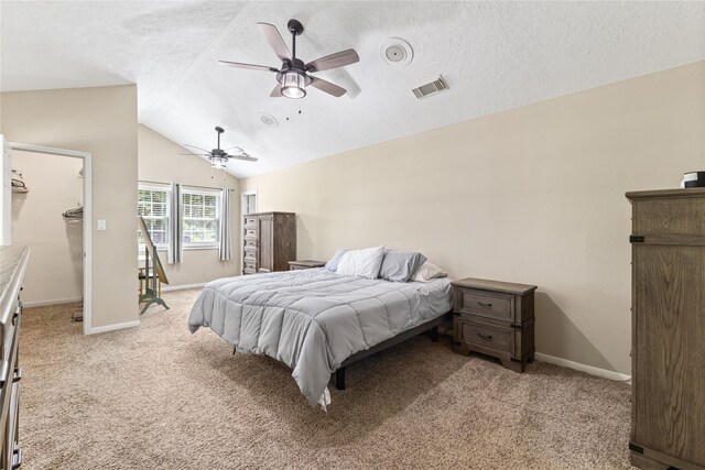 3358 County Road 172, Alvin, TX 77511 - bedroom featuring light carpet, vaulted ceiling, visible vents, and a textured ceiling