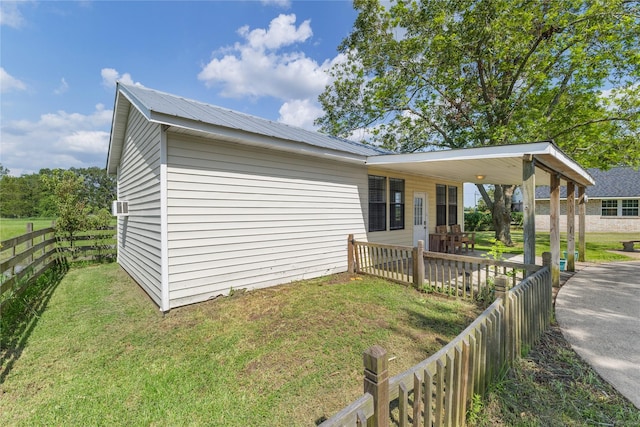 3358 County Road 172, Alvin, TX 77511 - view of side of property featuring a lawn, metal roof, and fence