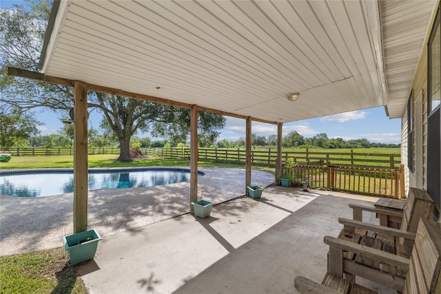 3358 County Road 172, Alvin, TX 77511 - view of patio / terrace featuring a fenced backyard, an outdoor pool, and a rural view