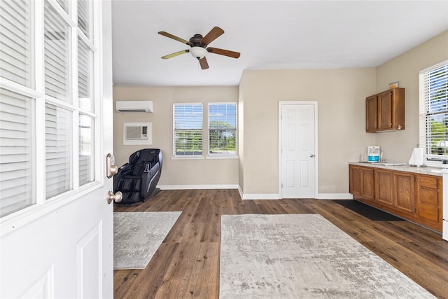3358 County Road 172, Alvin, TX 77511 - office space with dark wood-style flooring, an AC wall unit, baseboards, and ceiling fan