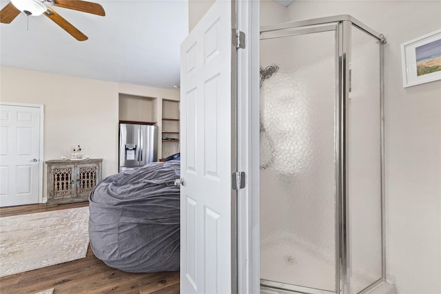 3358 County Road 172, Alvin, TX 77511 - bathroom with a stall shower, wood finished floors, ceiling fan, and ensuite bath