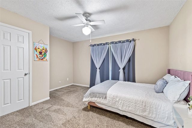 3358 County Road 172, Alvin, TX 77511 - carpeted bedroom with baseboards, a textured ceiling, and a ceiling fan