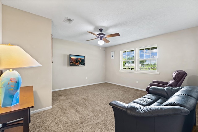 3358 County Road 172, Alvin, TX 77511 - carpeted living room with visible vents, a textured ceiling, baseboards, and ceiling fan