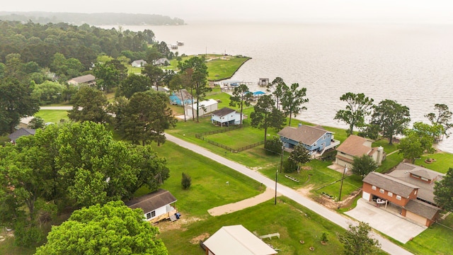 drone / aerial view featuring a residential view and a water view