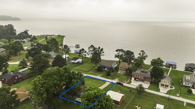 drone / aerial view with a residential view and a water view
