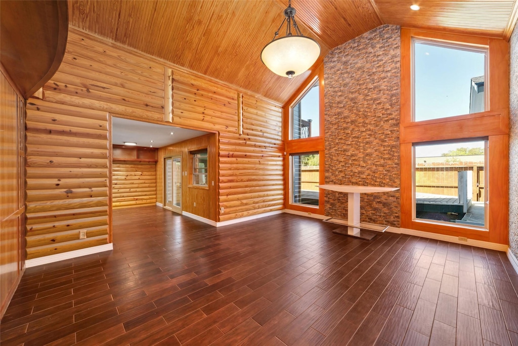 13222 Agarita Ln, Houston, TX 77083 - unfurnished living room featuring a wealth of natural light, high vaulted ceiling, wooden ceiling, and log walls
