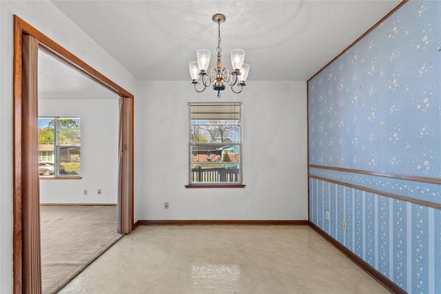 1403 Marlock Ln, Pasadena, TX 77502 - carpeted spare room with a chandelier, wallpapered walls, and baseboards