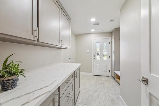 18602 Carriage Ct, Houston, TX 77058 - laundry area featuring baseboards, light marble finish floors, recessed lighting, and hookup for an electric dryer