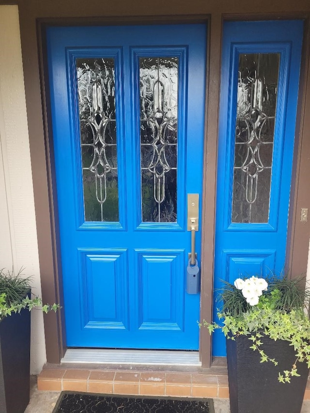 18602 Carriage Ct, Houston, TX 77058 - property entrance featuring french doors and stucco siding
