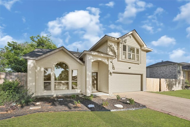 1410 Wesley Ln, Deer Park, TX 77536 - traditional-style home featuring brick siding, an attached garage, and driveway