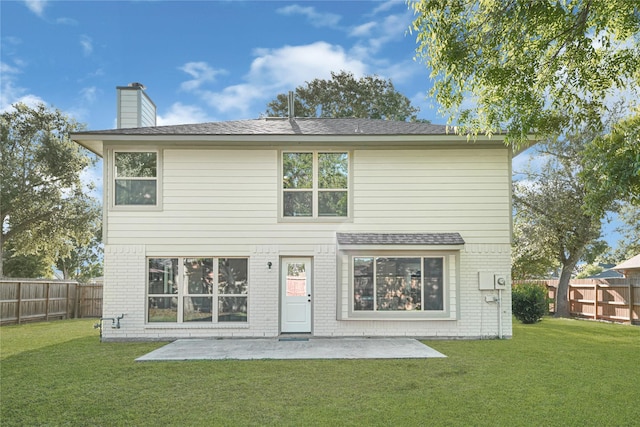 1410 Wesley Ln, Deer Park, TX 77536 - back of house featuring brick siding, a chimney, a patio, and a shingled roof