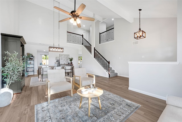 1410 Wesley Ln, Deer Park, TX 77536 - living room with high vaulted ceiling, a chandelier, wood finished floors, baseboards, and a ceiling fan
