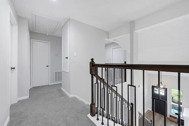 1410 Wesley Ln, Deer Park, TX 77536 - hallway with attic access, an upstairs landing, baseboards, and carpet flooring