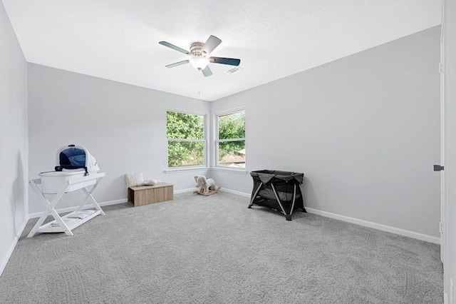 1410 Wesley Ln, Deer Park, TX 77536 - carpeted bedroom with baseboards and ceiling fan