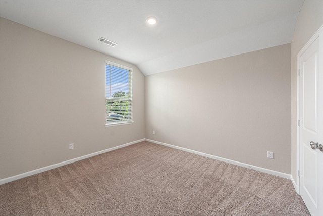 210 Fulton Station Dr, Houston, TX 77009 - empty room featuring visible vents, baseboards, vaulted ceiling, and carpet floors