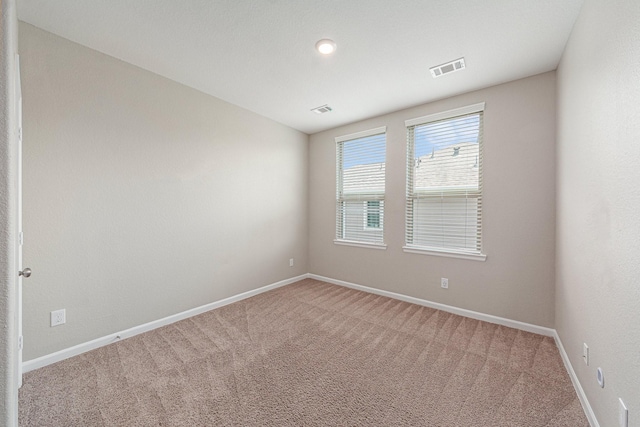210 Fulton Station Dr, Houston, TX 77009 - empty room featuring baseboards, visible vents, and carpet