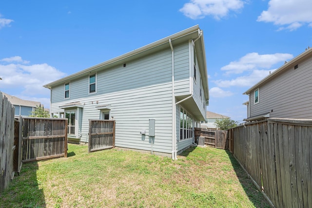 210 Fulton Station Dr, Houston, TX 77009 - rear view of property with a yard and a fenced backyard