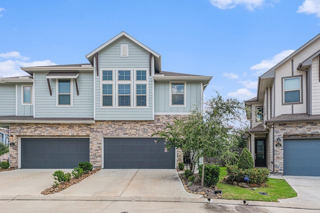 210 Fulton Station Dr, Houston, TX 77009 - townhome / multi-family property featuring board and batten siding, an attached garage, stone siding, and concrete driveway