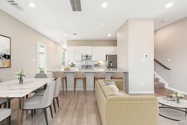 210 Fulton Station Dr, Houston, TX 77009 - living area featuring recessed lighting, visible vents, and light wood finished floors