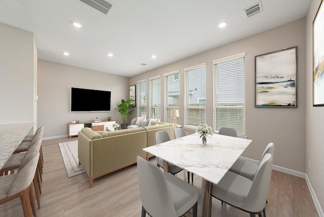 210 Fulton Station Dr, Houston, TX 77009 - dining room with recessed lighting, baseboards, visible vents, and light wood-style flooring