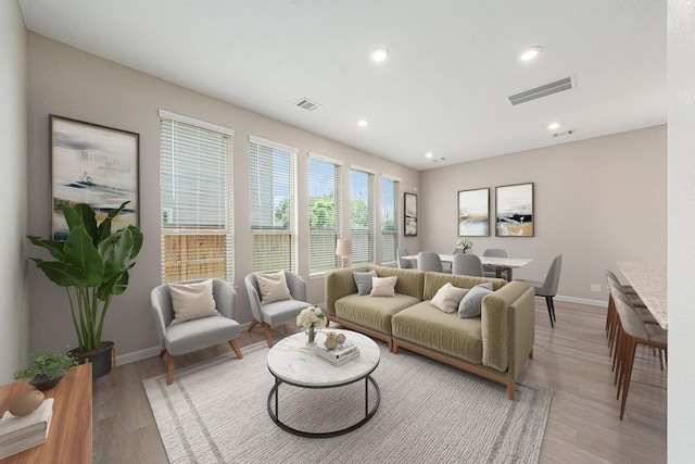 210 Fulton Station Dr, Houston, TX 77009 - living area featuring recessed lighting, light wood-style flooring, visible vents, and baseboards