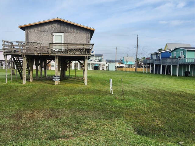 view of yard with stairway and a deck