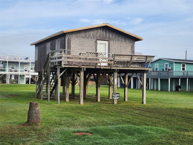 view of property's community featuring a yard, a deck, and a carport