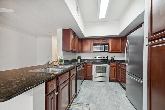 7575 Kirby Dr Unit 1108, Houston, TX 77030 - kitchen with a peninsula, crown molding, stainless steel appliances, dark stone countertops, and a sink