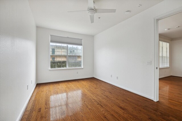 7575 Kirby Dr Unit 1108, Houston, TX 77030 - empty room featuring baseboards, ceiling fan, and wood finished floors