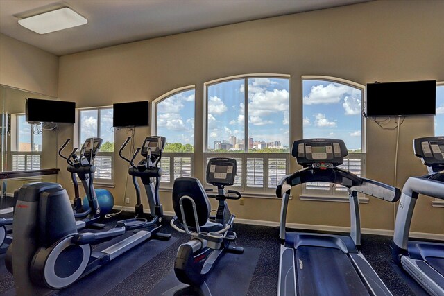 7575 Kirby Dr Unit 1108, Houston, TX 77030 - exercise room featuring baseboards