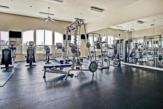 7575 Kirby Dr Unit 1108, Houston, TX 77030 - exercise room featuring a wealth of natural light, visible vents, baseboards, and a ceiling fan