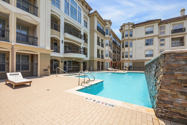 7575 Kirby Dr Unit 1108, Houston, TX 77030 - pool with fence and a patio