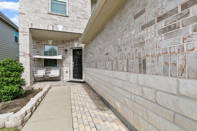13754 Evansdale Ln, Houston, TX 77083 - entrance to property with a patio area and brick siding