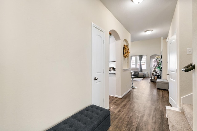 13754 Evansdale Ln, Houston, TX 77083 - hall with dark wood-type flooring, baseboards, and arched walkways