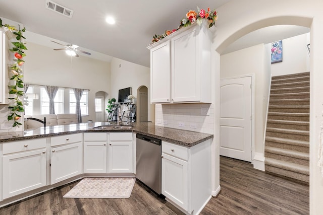 13754 Evansdale Ln, Houston, TX 77083 - kitchen with dishwasher, arched walkways, a sink, ceiling fan, and dark wood-type flooring