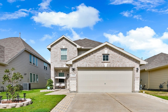 13754 Evansdale Ln, Houston, TX 77083 - traditional-style house with brick siding, driveway, a front lawn, an attached garage, and central air condition unit