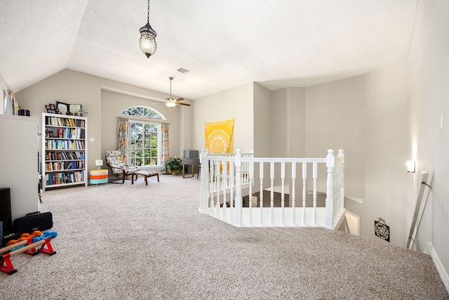 rec room featuring visible vents, vaulted ceiling, carpet flooring, and a ceiling fan