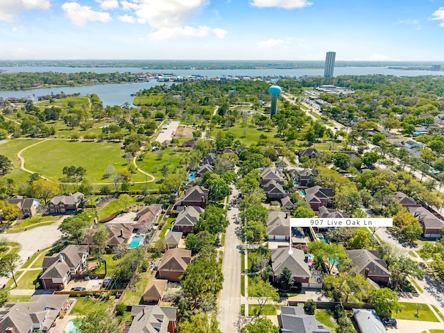 drone / aerial view featuring a residential view and a water view