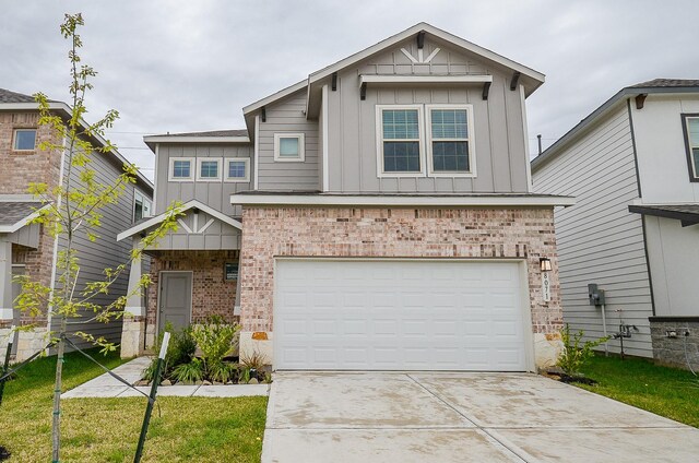 view of front of property with driveway, brick siding, board and batten siding, and an attached garage