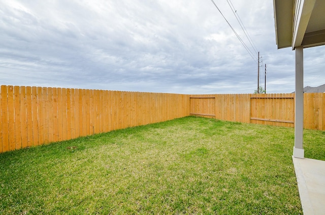 view of yard with a fenced backyard