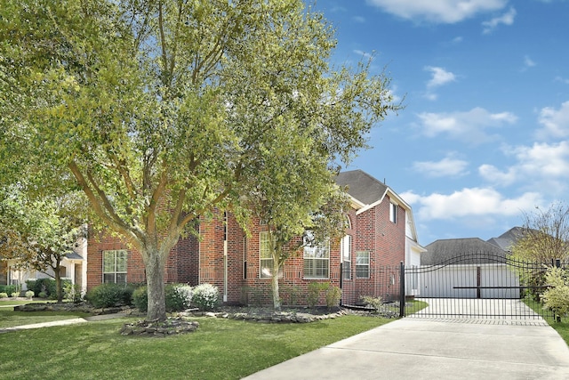 17203 Country Brook Ln, Houston, TX 77095 - obstructed view of property featuring brick siding, a gate, concrete driveway, a front lawn, and an attached garage