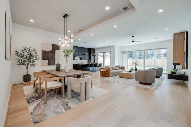 dining space with light wood finished floors, visible vents, ceiling fan, and recessed lighting