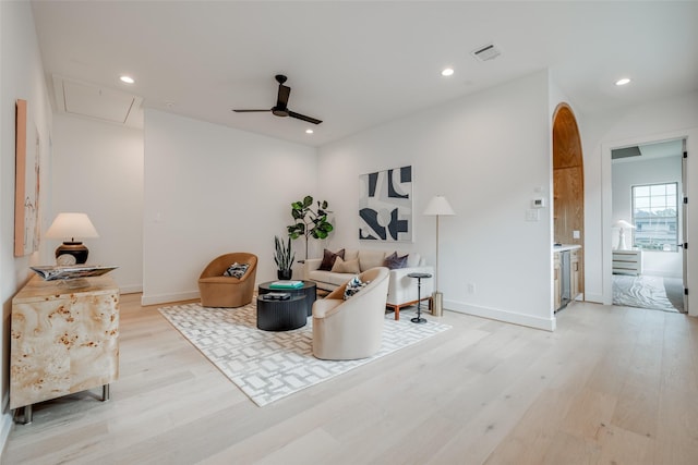 sitting room with a ceiling fan, light wood finished floors, attic access, visible vents, and recessed lighting