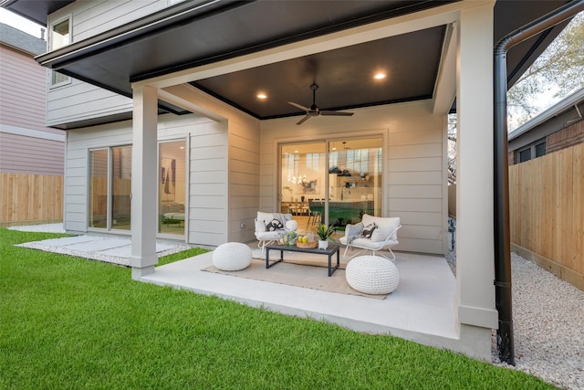 view of patio / terrace featuring fence and a ceiling fan