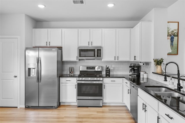 30208 Arnold Branch Dr, Magnolia, TX 77355 - kitchen featuring a sink, appliances with stainless steel finishes, and white cabinets