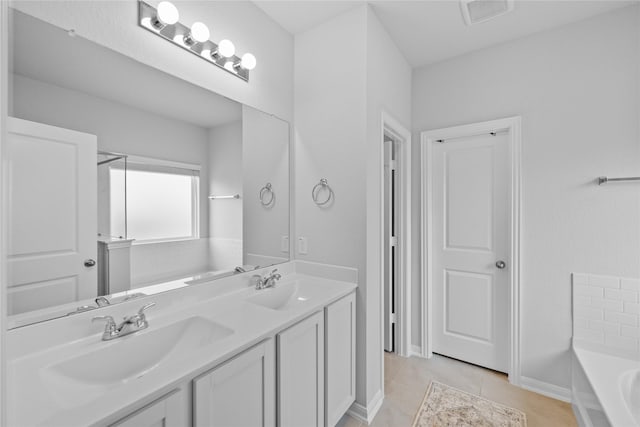 30208 Arnold Branch Dr, Magnolia, TX 77355 - bathroom featuring a sink, tile patterned floors, a washtub, and visible vents