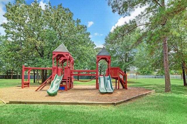 30208 Arnold Branch Dr, Magnolia, TX 77355 - community play area featuring a lawn and fence