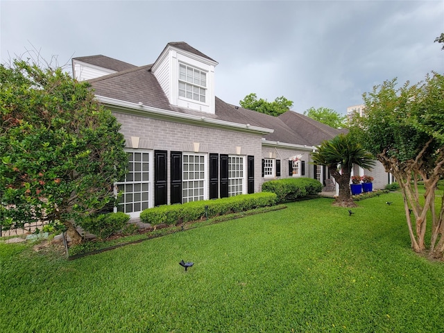 4401 Roseland St, Houston, TX 77006 - back of house with a yard and brick siding
