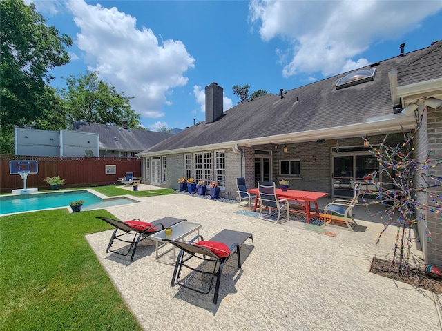 4401 Roseland St, Houston, TX 77006 - rear view of property with a patio area, a chimney, brick siding, and roof with shingles