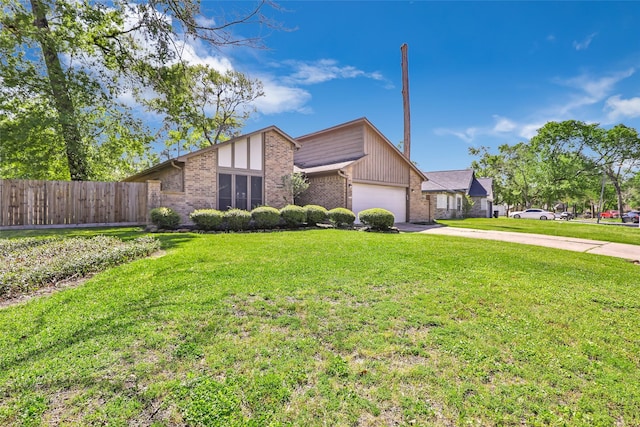 16002 Castaway Ct, Crosby, TX 77532 - mid-century modern home with brick siding, an attached garage, and driveway